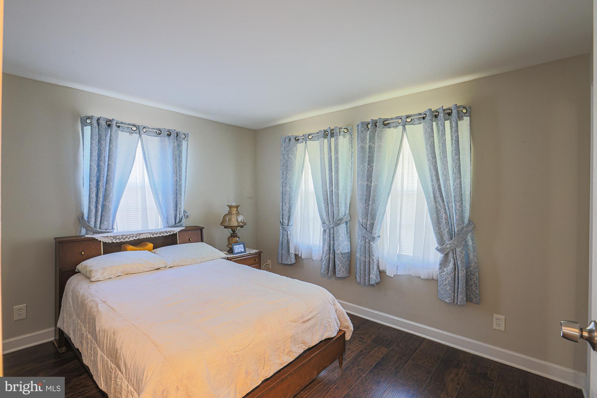7933 34th Street Rosedale, MD 21237 - Photo 16 of 32 a bedroom with a bed and a window
