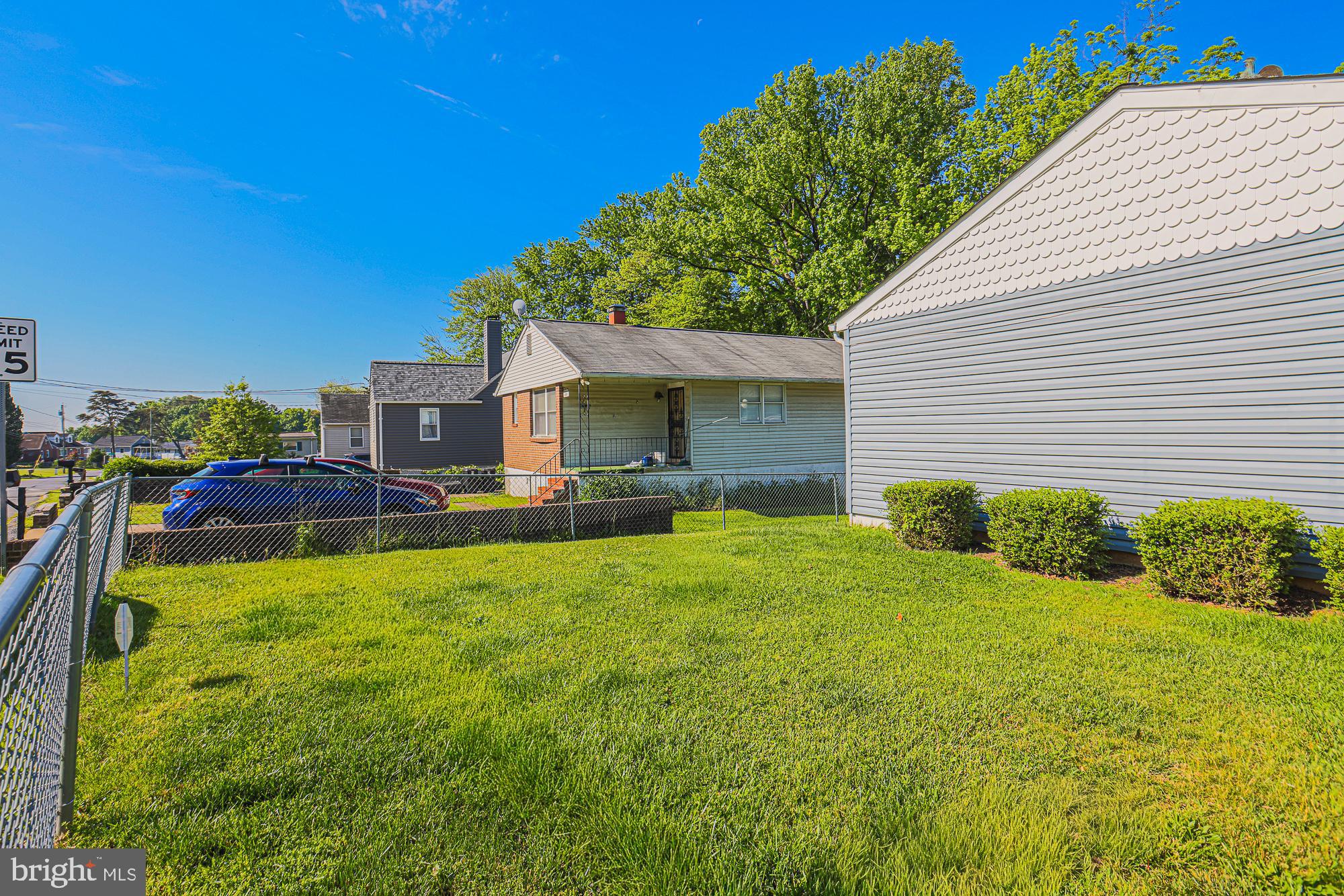 7933 34th Street Rosedale, MD 21237 - Photo 27 of 32 a front view of house with yard and green space