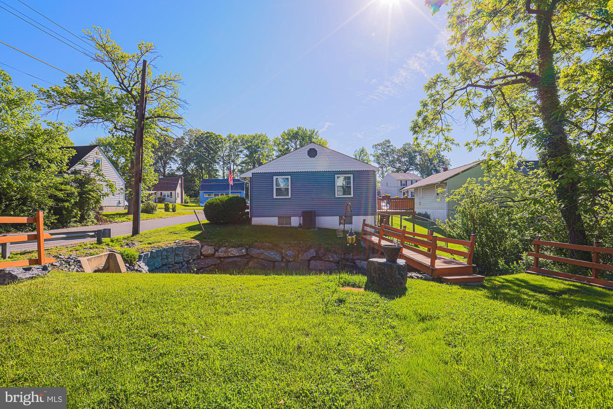 7933 34th Street Rosedale, MD 21237 - Photo 29 of 32 a front view of a house with a yard