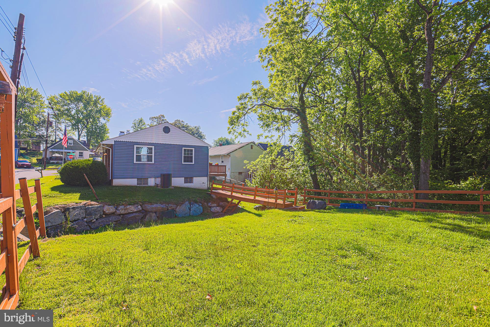 7933 34th Street Rosedale, MD 21237 - Photo 30 of 32 a view of a house with a big yard and large trees