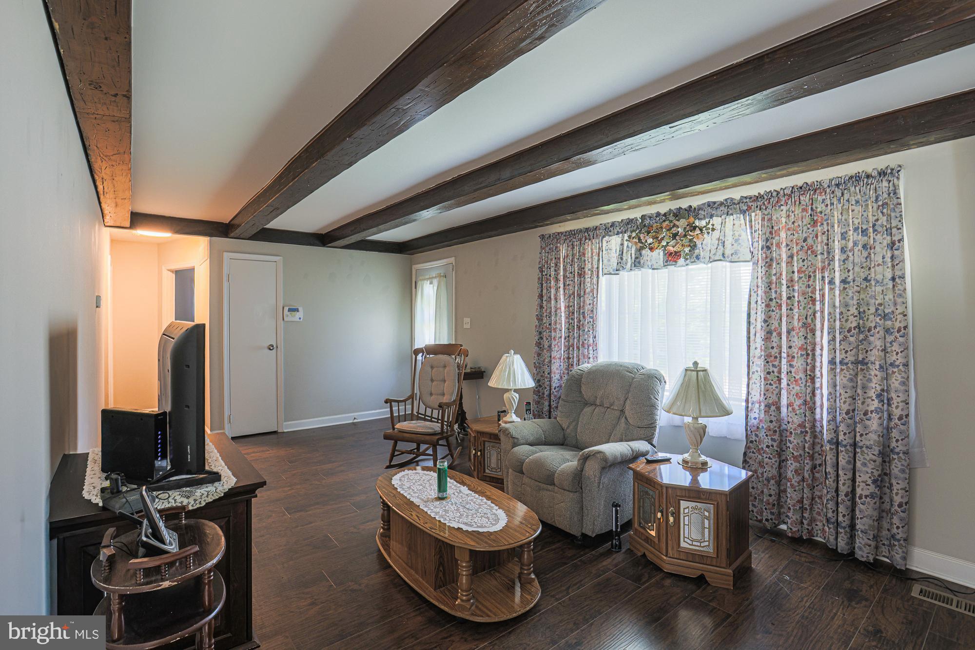 7933 34th Street Rosedale, MD 21237 - Photo 5 of 32 a living room with furniture and a flat screen tv
