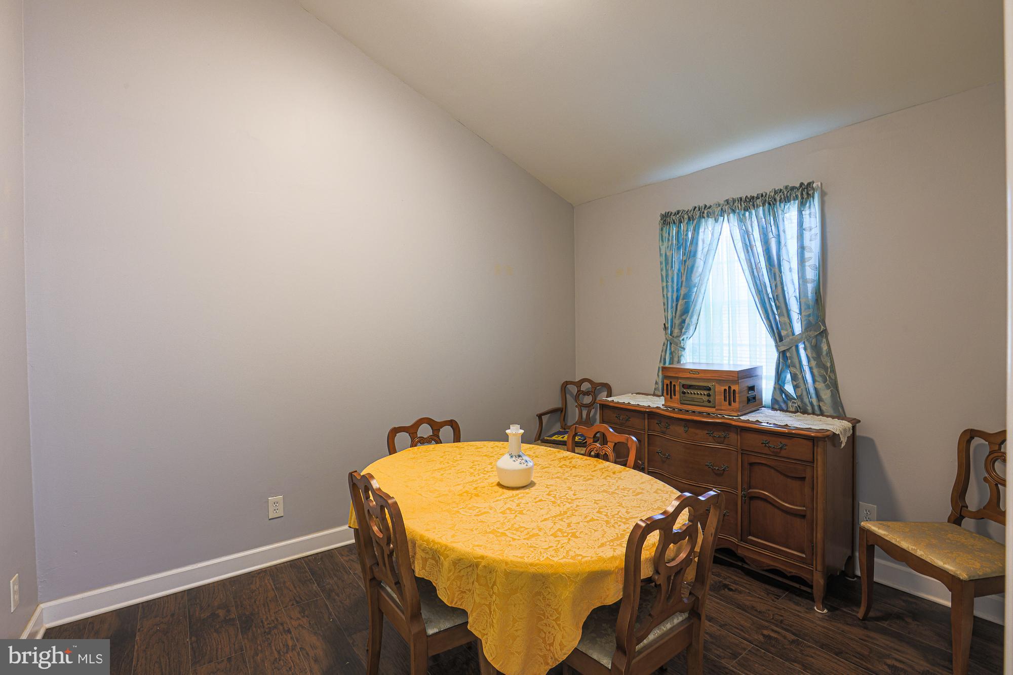 7933 34th Street Rosedale, MD 21237 - Photo 8 of 32 a dining room with a table and chairs