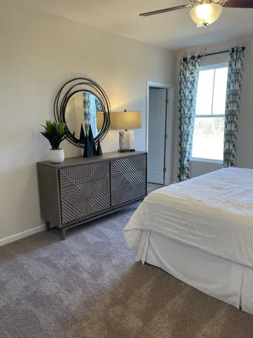 a bedroom with bed and window