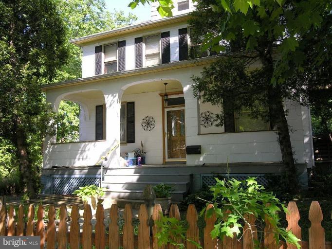 5007 Morello Road Baltimore, MD 21214 - Photo 1 of 28 a view of a house with brick walls and a flower garden