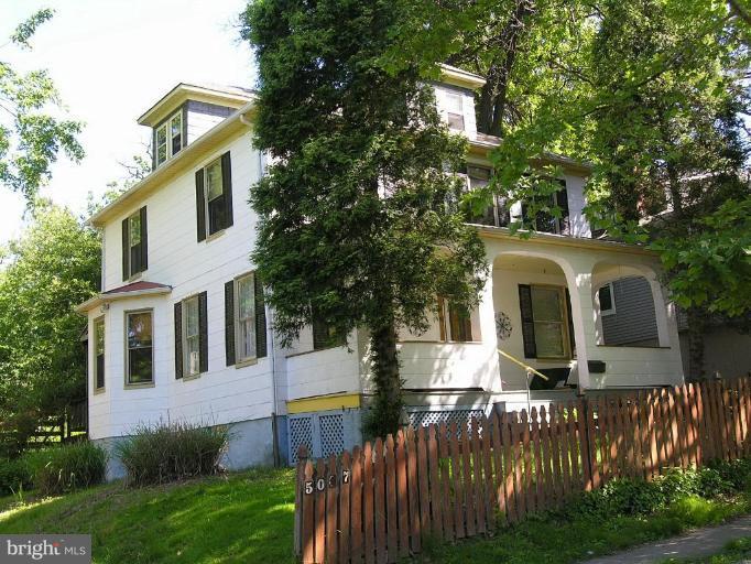 5007 Morello Road Baltimore, MD 21214 - Photo 2 of 28 a front view of house with yard and trees