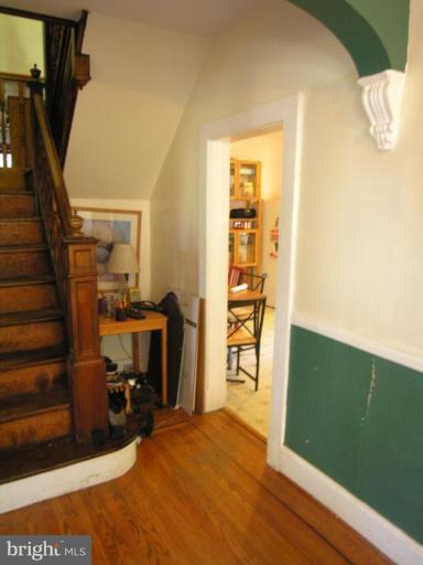 5007 Morello Road Baltimore, MD 21214 - Photo 14 of 28 a view of a bedroom with wooden floor and closet