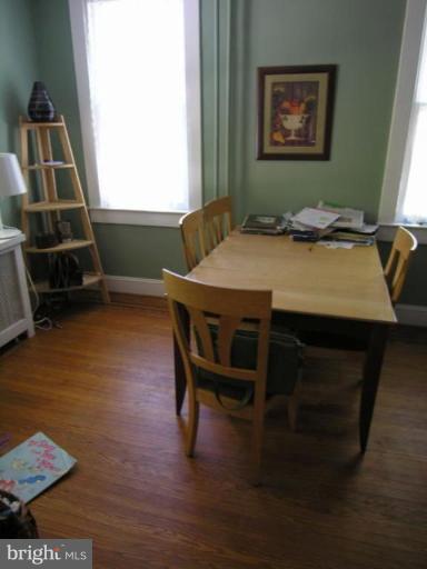 5007 Morello Road Baltimore, MD 21214 - Photo 17 of 28 a view of a dining room with furniture and wooden floor