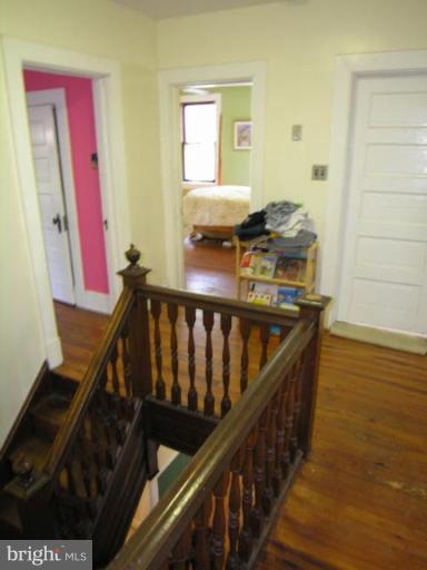 5007 Morello Road Baltimore, MD 21214 - Photo 25 of 28 a balcony with wooden floor and furniture