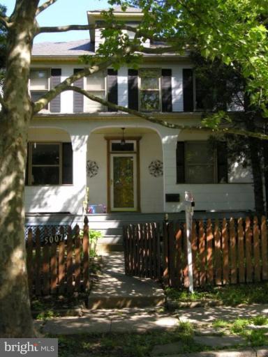 5007 Morello Road Baltimore, MD 21214 - Photo 26 of 28 a front view of a house with a yard
