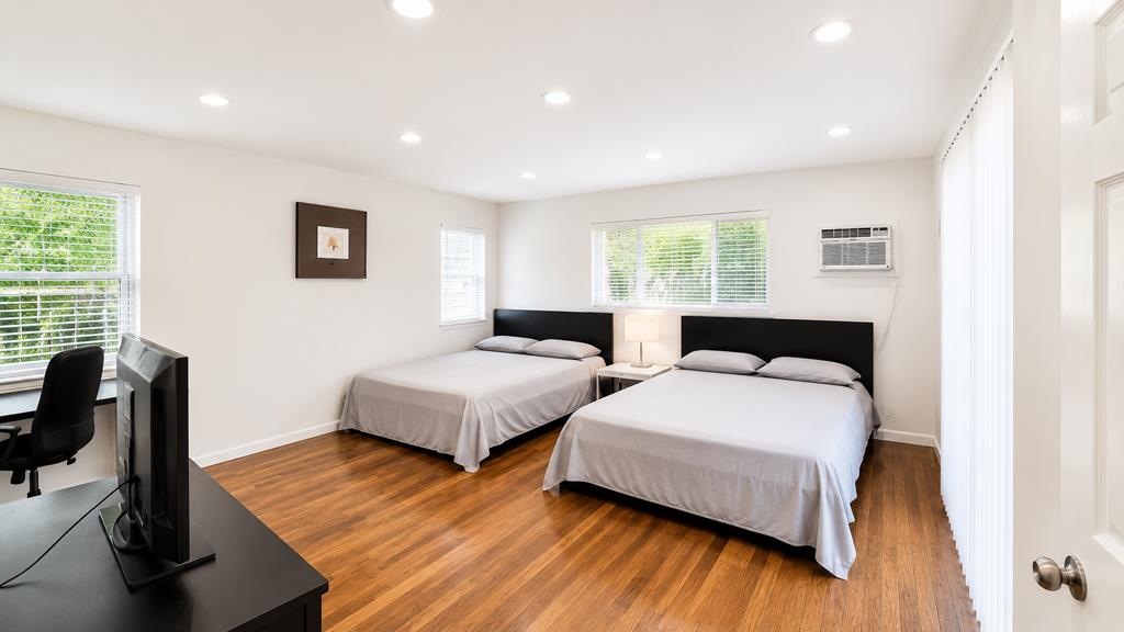 1281 Traynor Road Concord, CA 94520 - Photo 22 of 41 a spacious bedroom with a bed and wooden floor