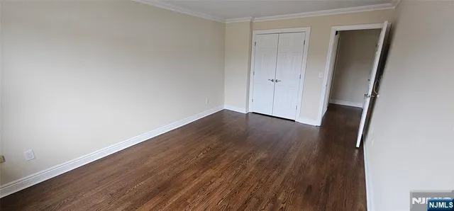 an empty room with wooden floor