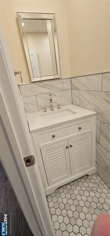 a bathroom with a sink a vanity and a mirror