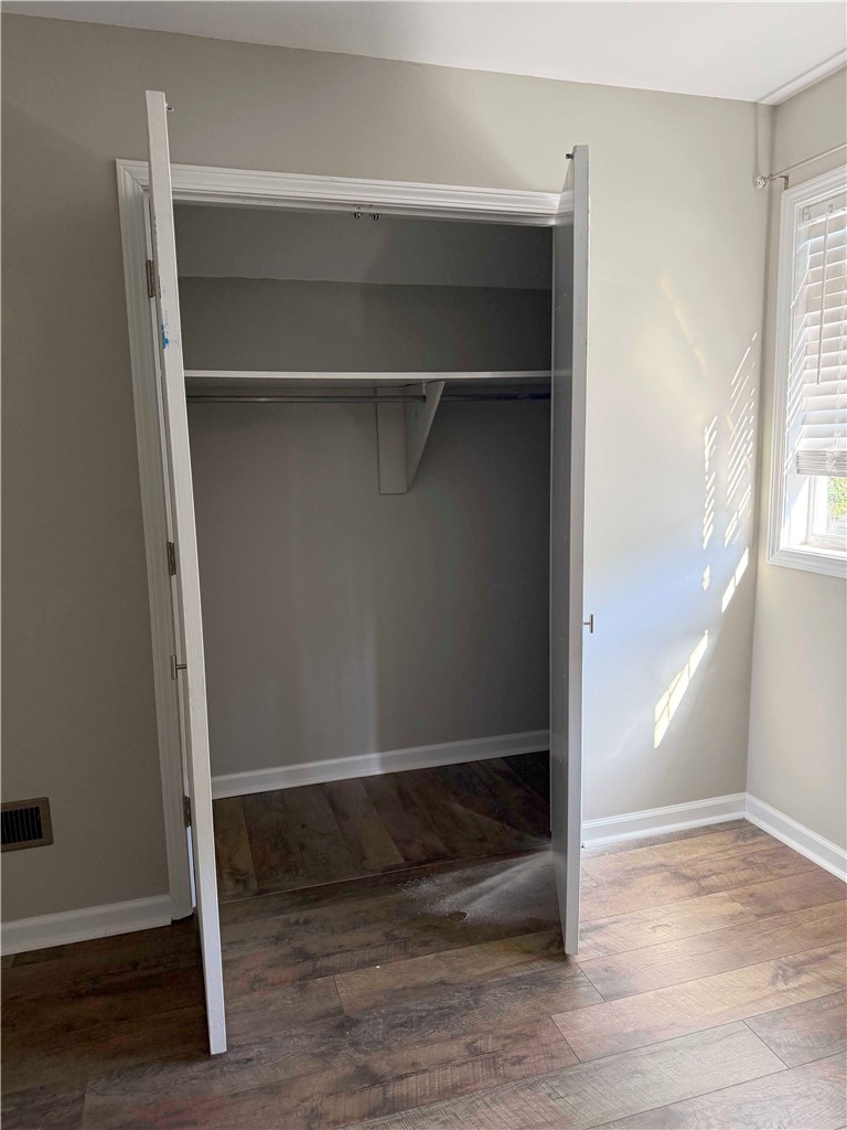 116 Kelly Lane Easley, SC 29642 - Photo 29 of 39 Rich wood-inspired flooring and clean trim frame a functional built-in closet space. Bedroom 2
