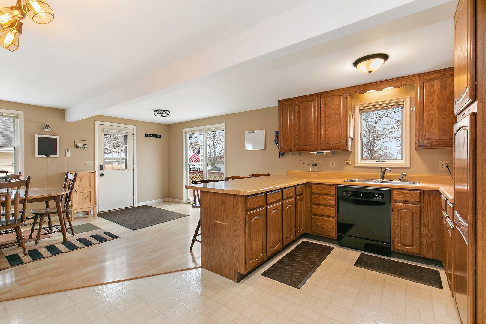 6770 Cherry Valley Road Kingston, IL 60145 - Photo 5 of 15 a kitchen with stainless steel appliances granite countertop a stove a sink dishwasher and a refrigerator