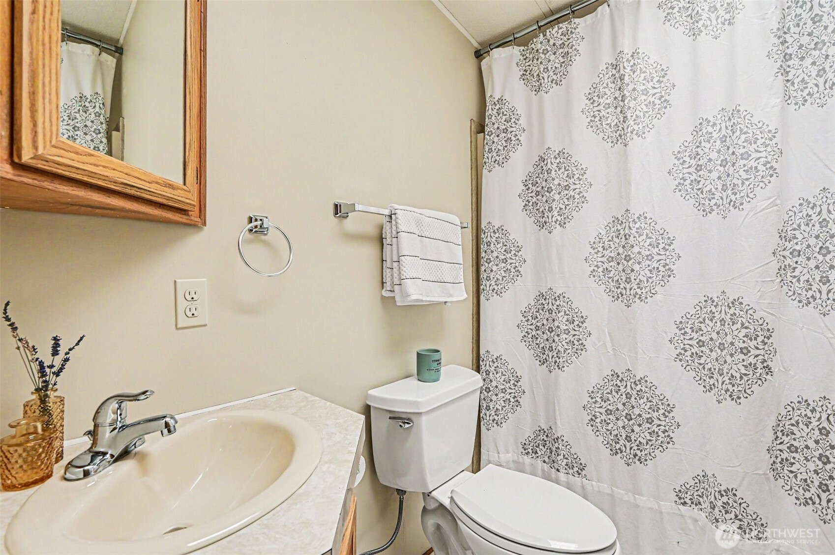 17308 Woodcrest Drive Northeast Bothell, WA 98011 - Photo 19 of 38 a bathroom with a sink toilet and shower