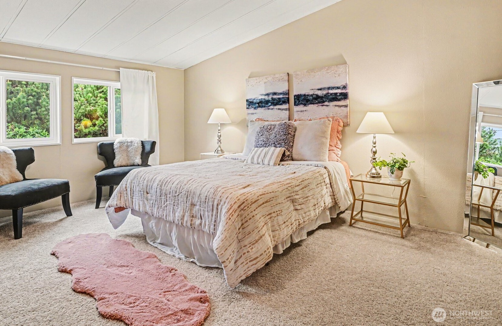 17308 Woodcrest Drive Northeast Bothell, WA 98011 - Photo 23 of 38 a bedroom with a bed and a couch