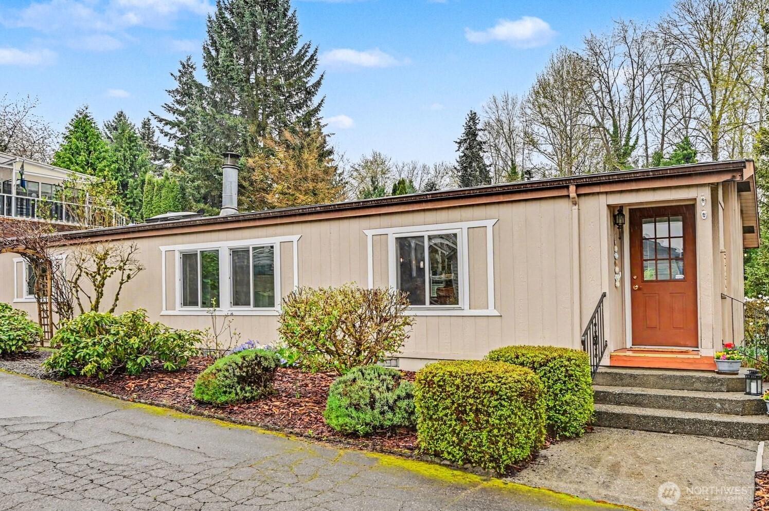 17308 Woodcrest Drive Northeast Bothell, WA 98011 - Photo 3 of 38 a front view of a house with garden