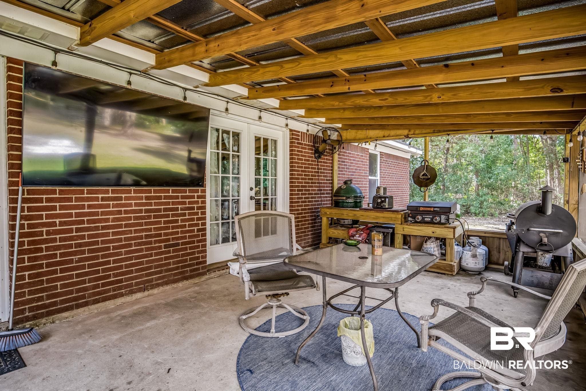 12199 Bay Road West Foley, AL 36535 - Photo 46 of 62 View of patio with grilling area, outdoor dining space, and french doors