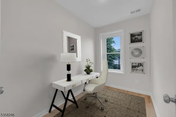 a workspace with furniture and window