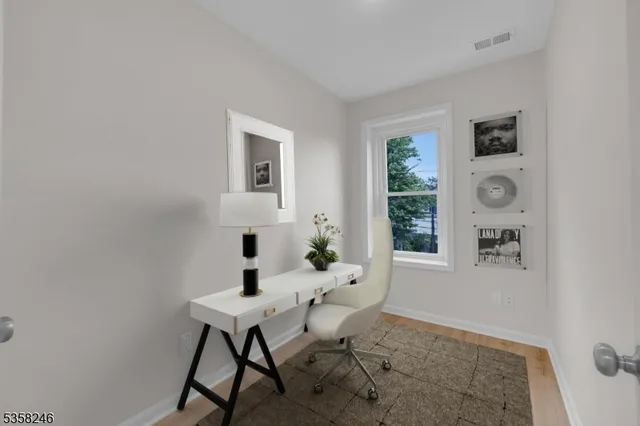 a workspace with furniture and window