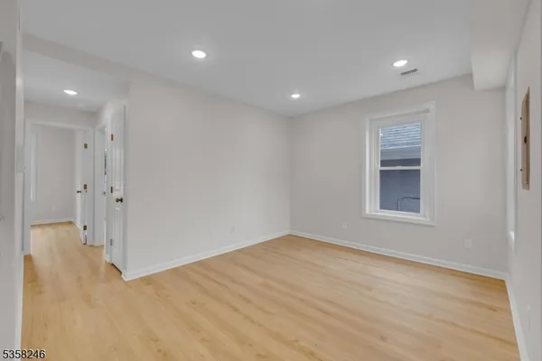 a view of livingroom with hardwood floor and hallway