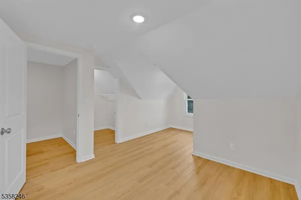 a bathroom with a sink toilet vanity and shower