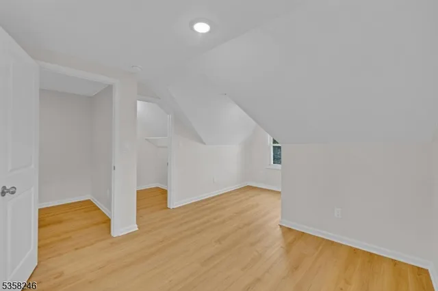 a bathroom with a sink toilet vanity and shower