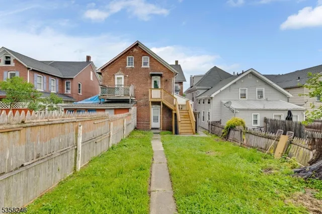 a view of a house with iron stairs