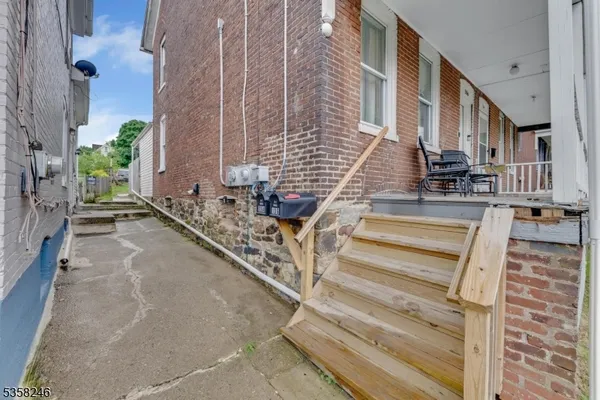 a front view of a residential apartment building with a yard