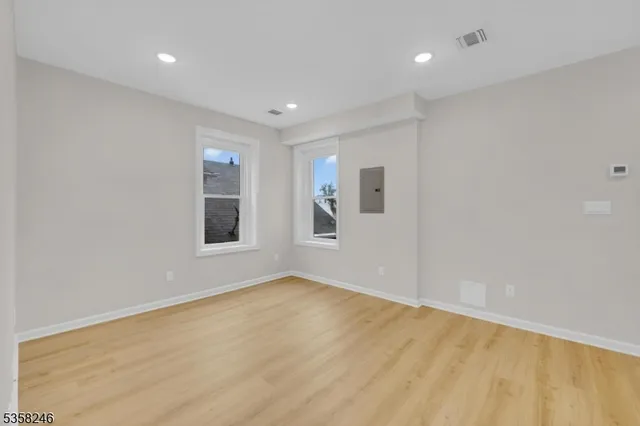 a view of an empty room with glass door