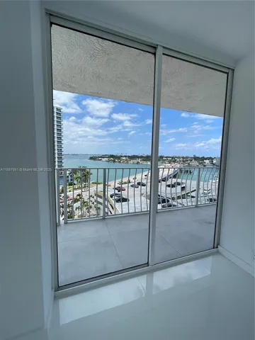 a bathroom with a double vanity sink and a large mirror