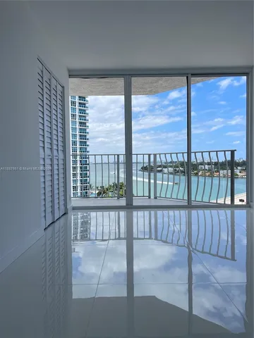 a view of a large window with wooden floor