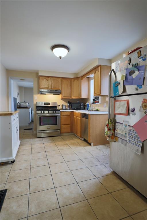 1923 Wharton Street Pittsburgh, PA 15203 - Photo 14 of 34 a kitchen with stainless steel appliances granite countertop a stove and a sink