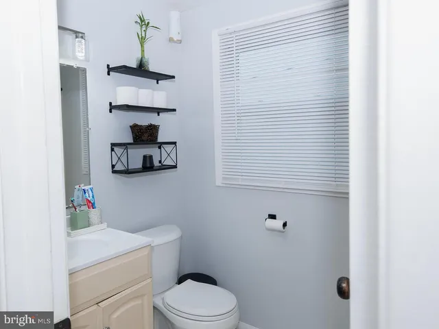 a bathroom with a toilet and a sink