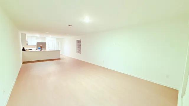 view of a hallway with wooden floor