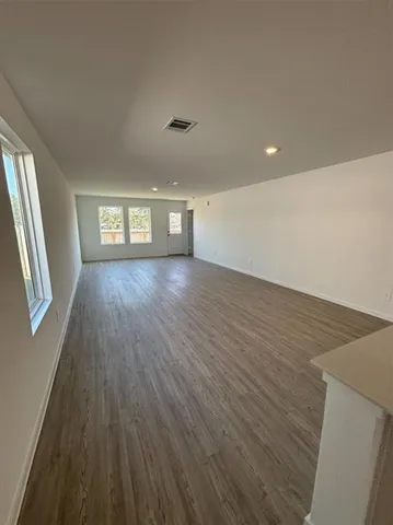 a kitchen with stainless steel appliances a stove microwave and sink