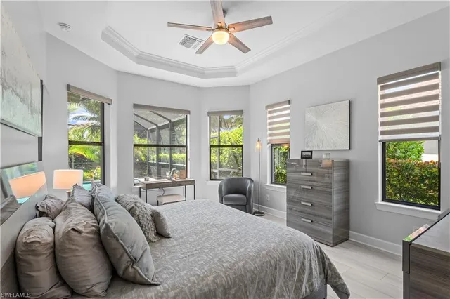 a bedroom with a bed dresser and a window