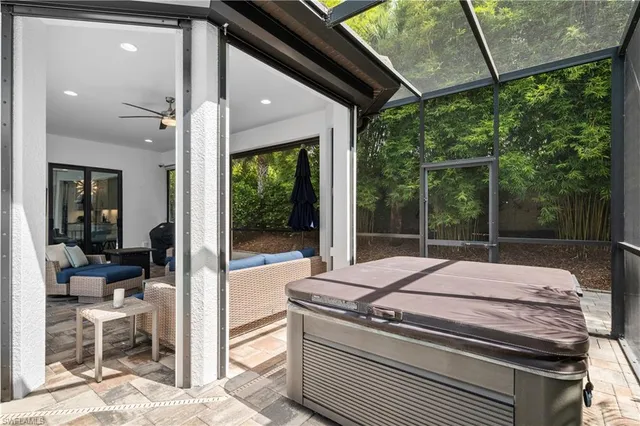 a view of a patio with table and chairs and potted plants