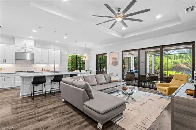a living room with furniture and a large window with outer view