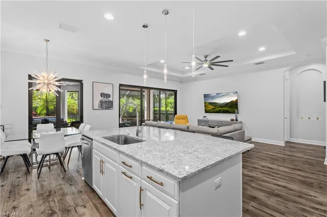 a kitchen with granite countertop living room and living room
