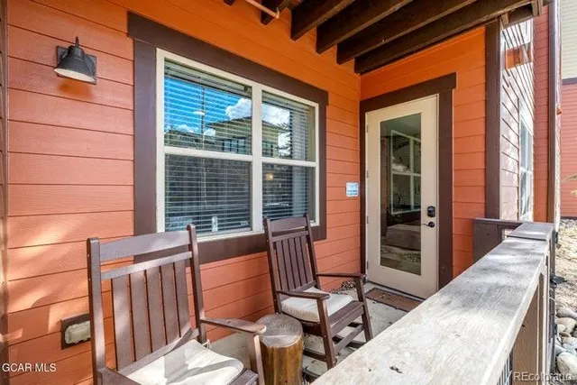 a view of a chair and table in the balcony