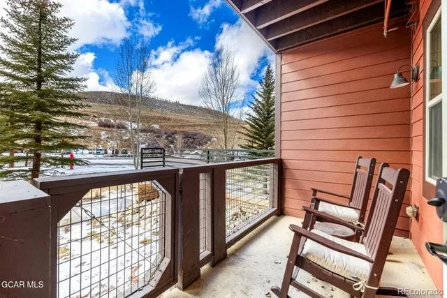 a front view of a house with a yard table and chairs
