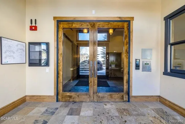 a view of a building with a snow on the road