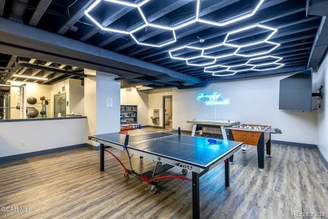 a lobby with furniture and flowers