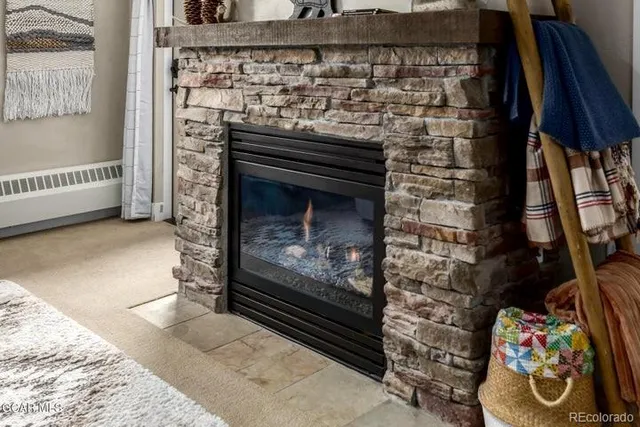 a living room with a couch and a fireplace