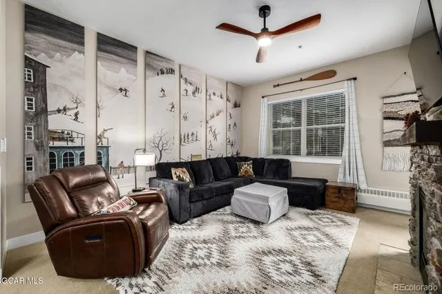 a living room with furniture window and wooden floor