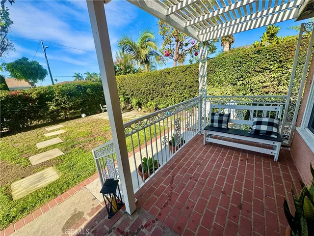 a view of balcony with wooden floor