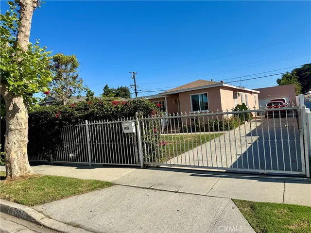 a view of a wrought iron fences in front of house