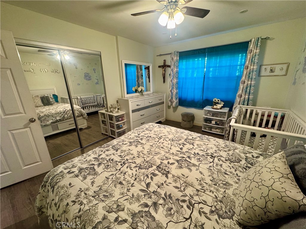 1203 West 134th Place Compton, CA 90222 - Photo 10 of 23 a living room with furniture and a chandelier