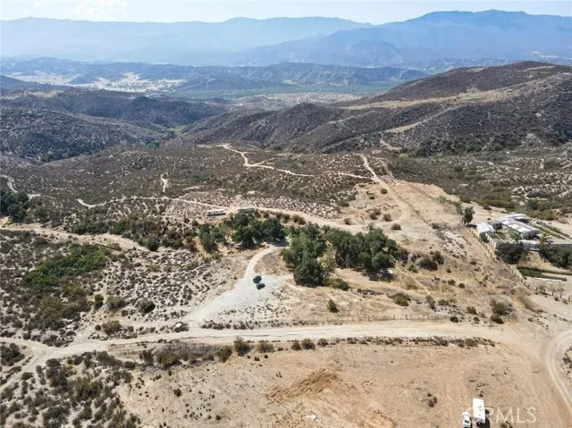 a view of a yard with a mountain